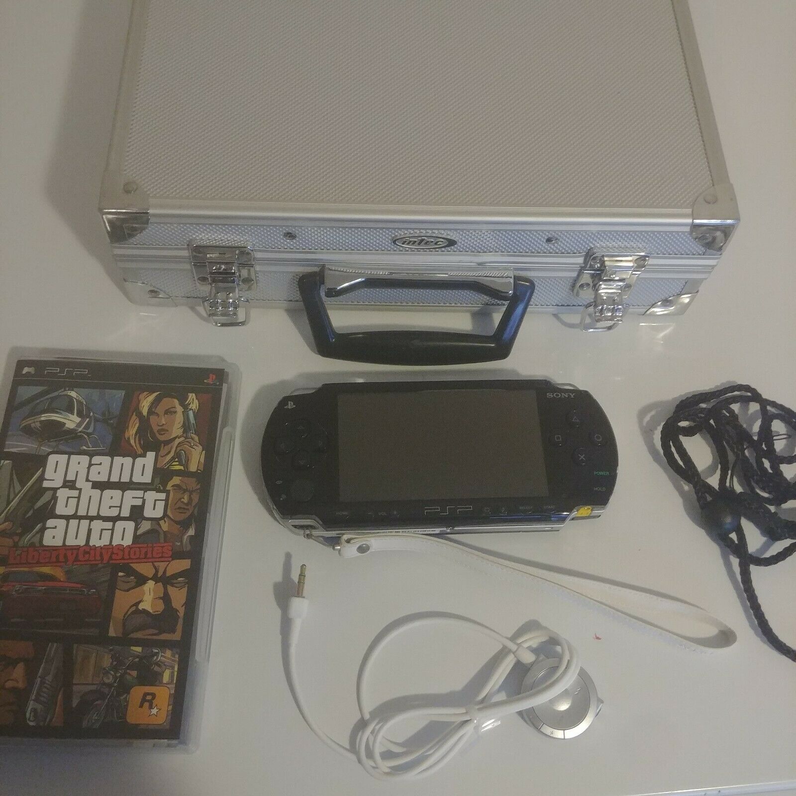 Sony PSP With Game, Accessories, and Carrying Case Read Description
