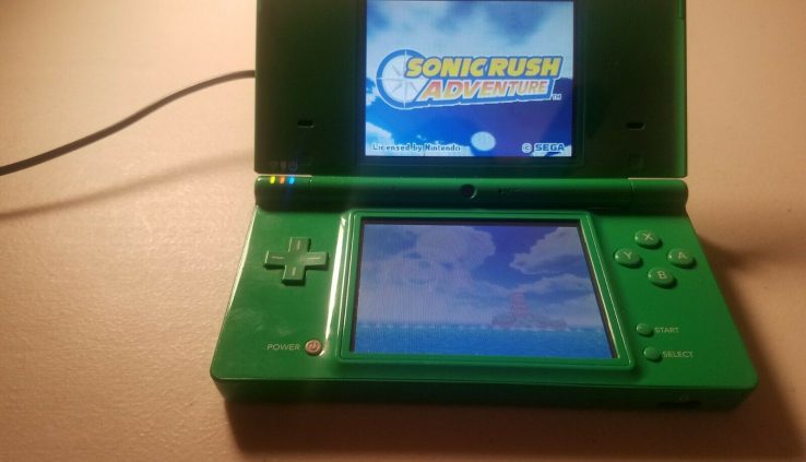 Green Nintendo DSi System, vitality twine and two video games.