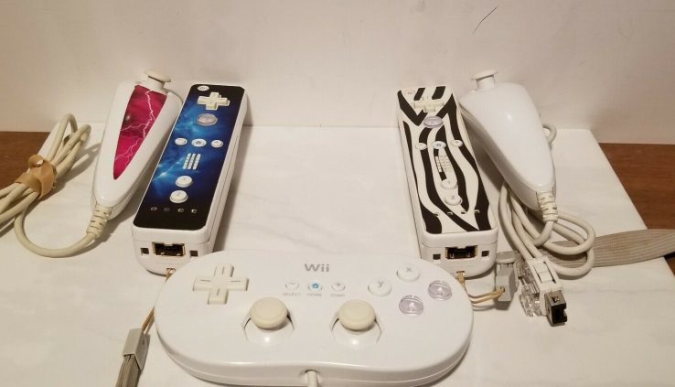 2 White W/Sticky label Wii Remotes, W Nunchucks, And 1 Controller