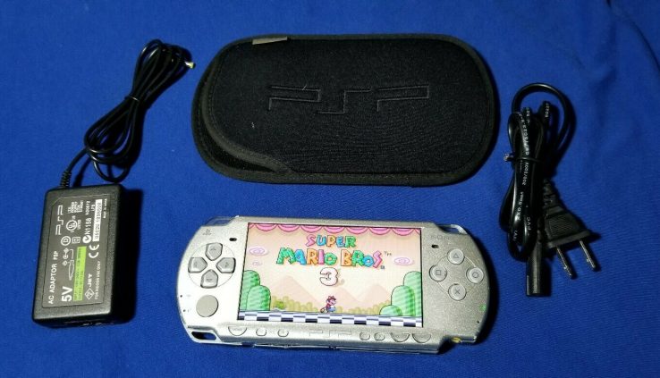 Sony psp 2000 / 2001 silver slim with 70 video games*32gb* 12 motion photos***tremendous deal***