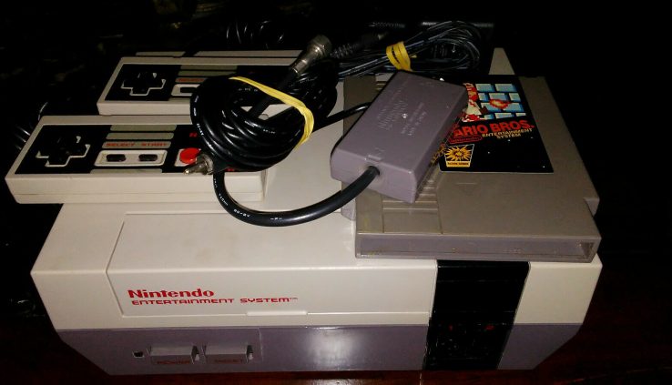 Nintendo NES console with 2 controllers Mario Bros.  CHECK IT OUT!!!!!