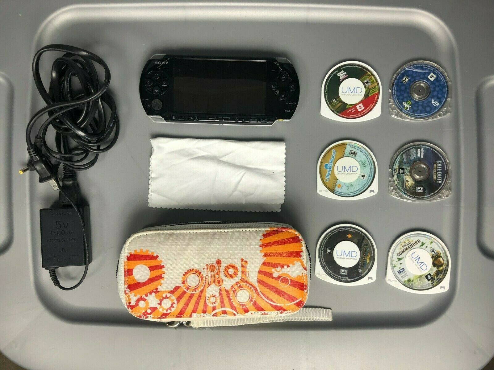 PSP 3001 Slim with Case, video games and charger. Barely aged