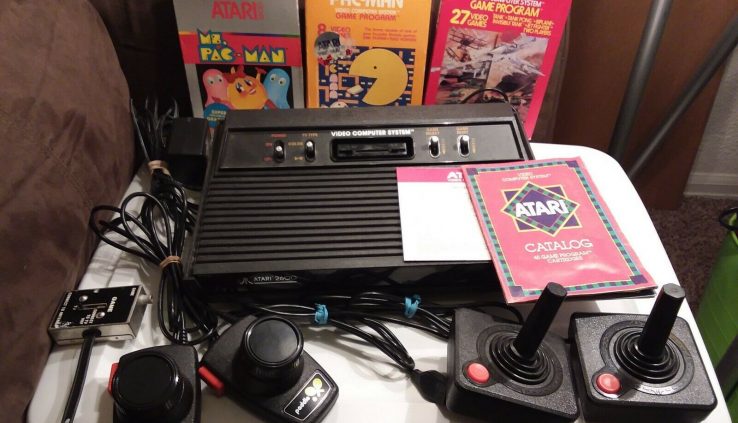 Vintage Atari 2600 Video Game Arrangement, Joysticks, Paddles and 3 Game Lot