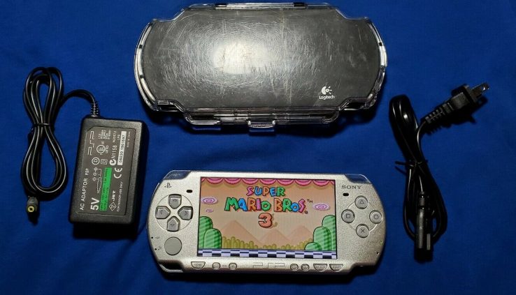 Sony psp 2000 / 2001 Silver with 100 video games***64gb*** 10 movies***titanic deal***