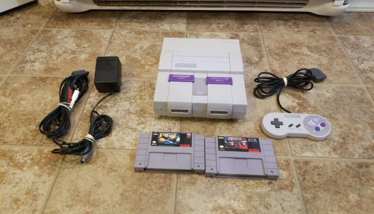 Nintendo SNES Console with Controller, Cables and a pair of games