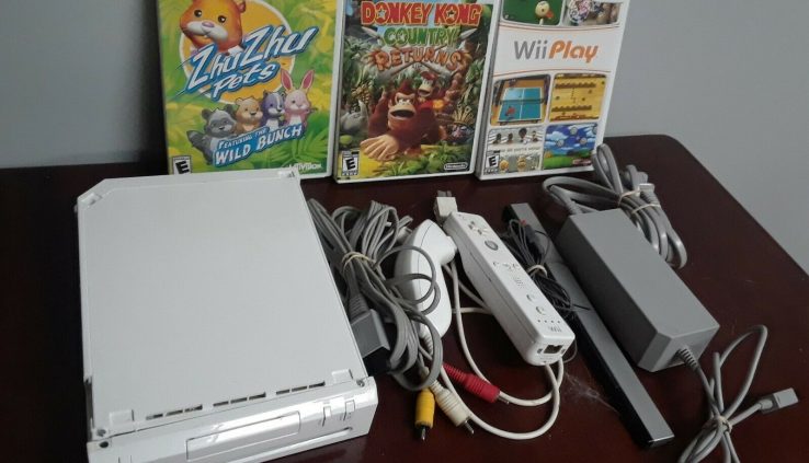 Nintendo Wii White Console with three games and a few controllers