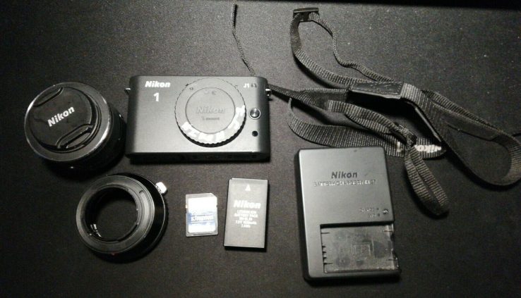 Nikon J1 Mirrorless DSLR Digicam With 10 – 30mm Lens Shadowy 