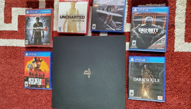 Sony PlayStation 4 Pro Console with Red Boring Redemption 2 and 6 Games