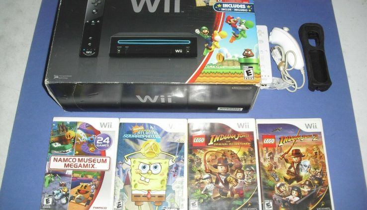 Dark Wii machine total in field w/ 2 controllers & 5 video games! Lego Indiana Jones