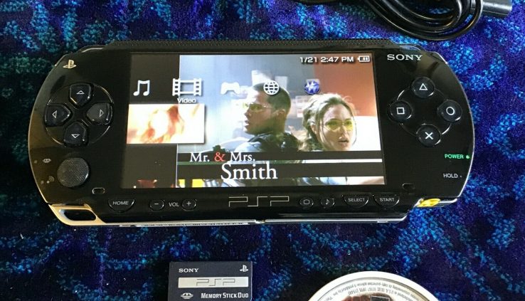 Sony PSP 1001 with 1 video games,1 movie,1 battery,1 charger,1 memory card.