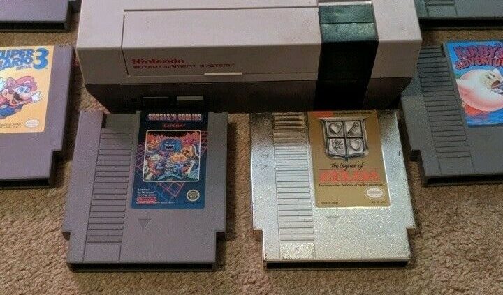 Normal nintendo nes system console. 1985 with six video games. Zelda Gold