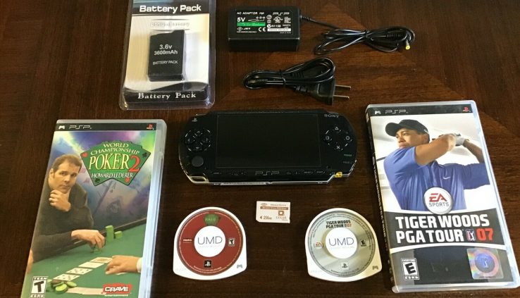 Sony PSP 1001 near with 2 video games,1 new battery,1 new charger, 1 memory card.