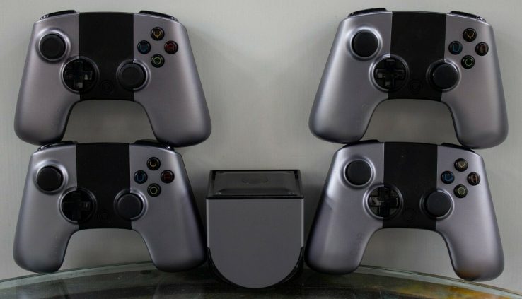 OUYA Micro Console and 4 Controllers (Be taught Description)