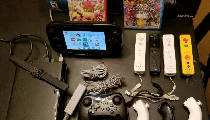 nintendo wii u 32gb black console with many extras. Unusual guitar hero sport.