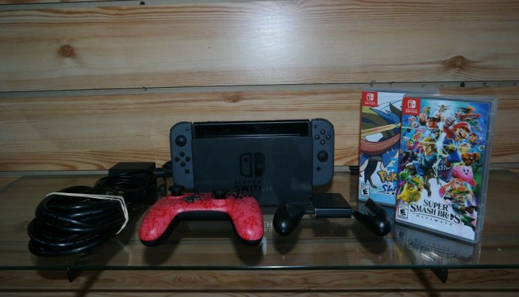 Nintendo Switch Console-Restricted Use W/ TWO GAMES AND EXTRA CONTROLLER HAC001