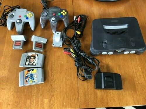 NINTENDO 64 ORIGINAL CHARCOAL GRAY 2 CONTROLLERS,  2 GAMES AND MORE NUS-001