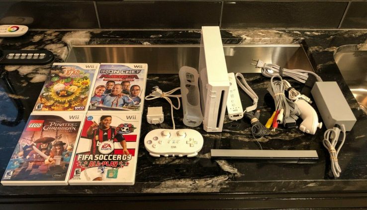 Nintendo Wii White Console Full System with 4 Video games! Wii Movement attachment!