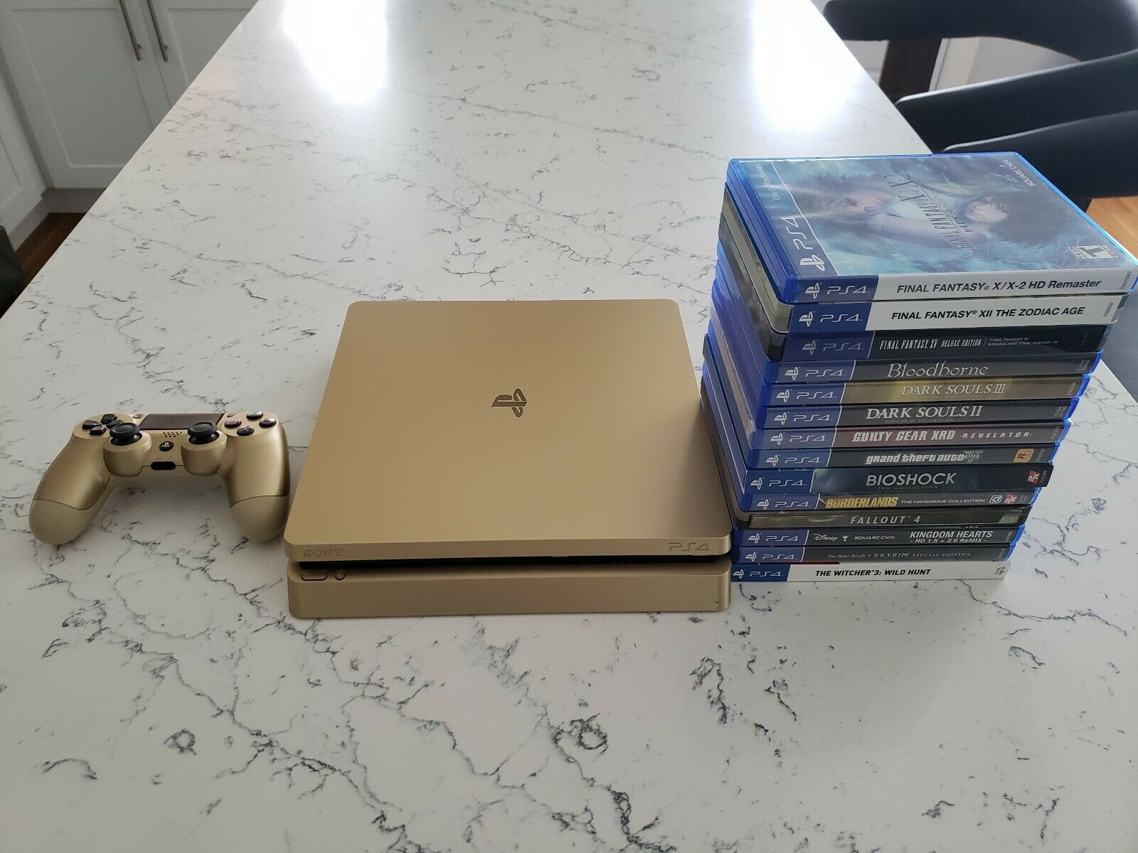 Gold PlayStation 4 (PS4) Slim - 1 TB w/ 14+ Video games and Controller