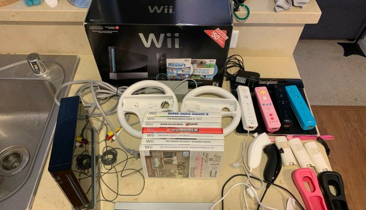 Nintendo Wii (Dark) Role: 7 games, 5 controllers, wireless charger, equipment 