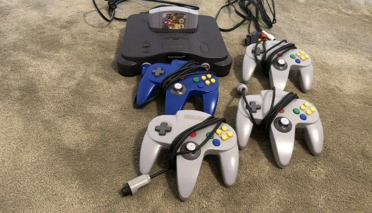 Nintendo 64 Game Console with all hook u.s.a.and 4 controllers 1 sport