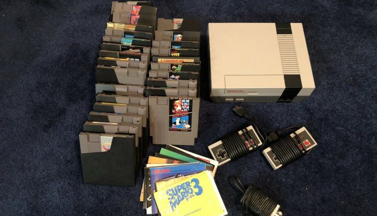 nintendo entertainment machine console and 27 games