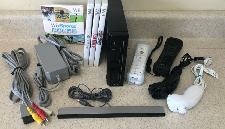Nintendo Wii Console (NTSC) w/ 2 Controllers, 4 video games (Wii Sports)