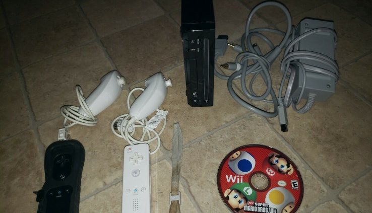 Murky Nintendo Wii Console With Natty Mario Bros 2 controllers